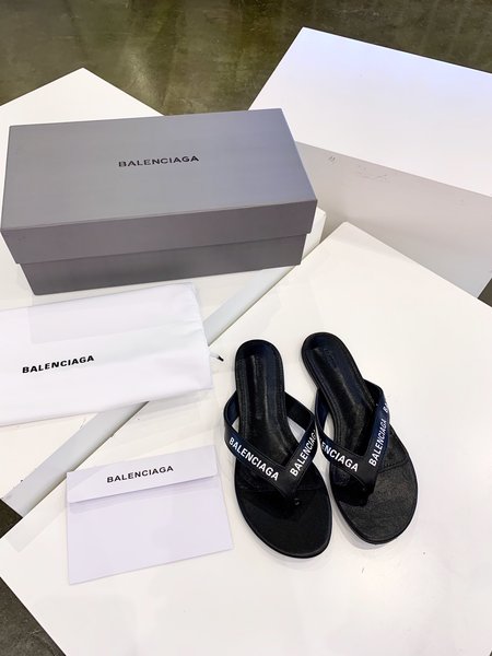 Balenciaga letter-embossed flip-flops