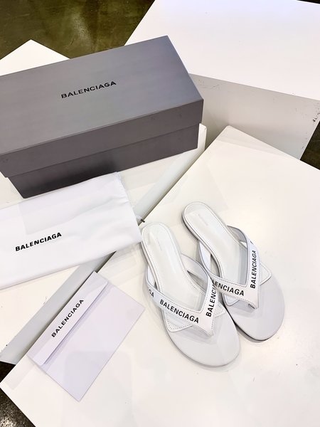 Balenciaga letter-embossed flip-flops