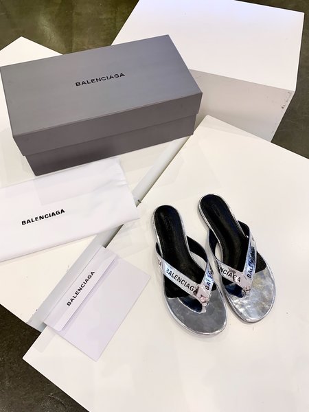 Balenciaga letter-embossed flip-flops