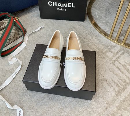 Chanel metal letter loafers