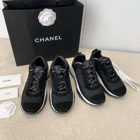 Chanel Letter Logo on the side of sneakers in black and white panda color