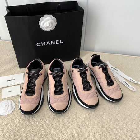 Chanel Letter Logo on the side of sneakers in black and white panda color