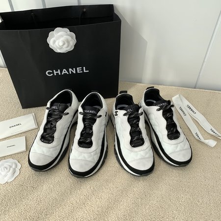 Chanel Letter Logo on the side of sneakers in black and white panda color