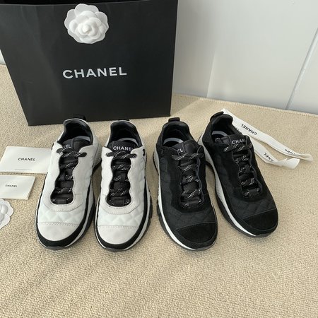 Chanel Letter Logo on the side of sneakers in black and white panda color