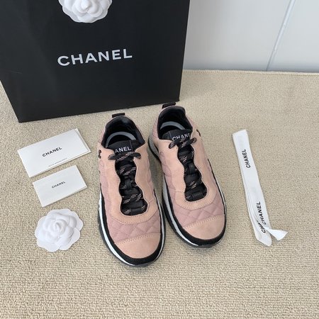 Chanel Letter Logo on the side of sneakers in black and white panda color