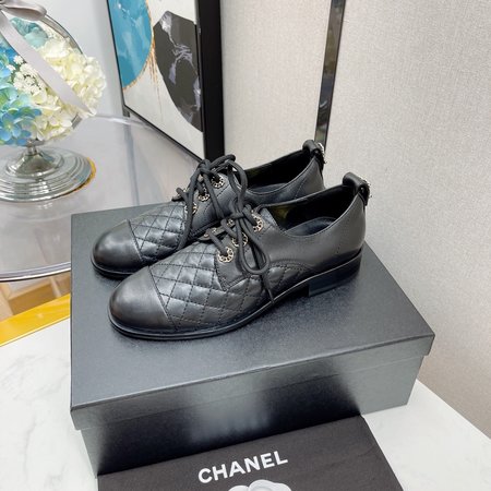 Chanel Lace-up diamond leather shoes with chain logo