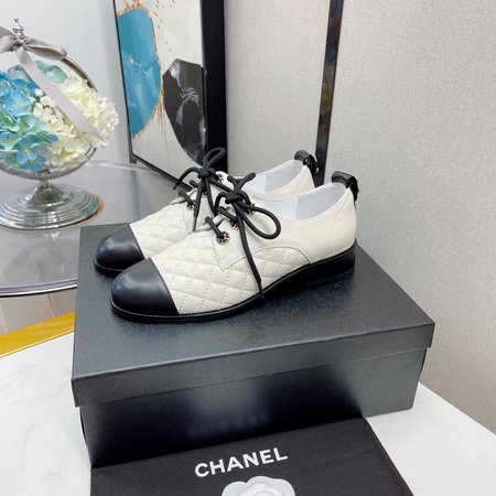 Chanel Lace-up diamond leather shoes with chain logo