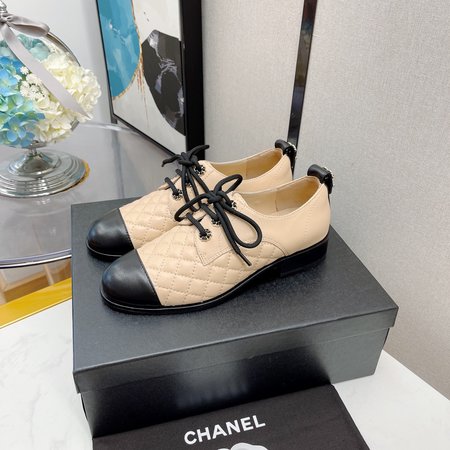 Chanel Lace-up diamond leather shoes with chain logo