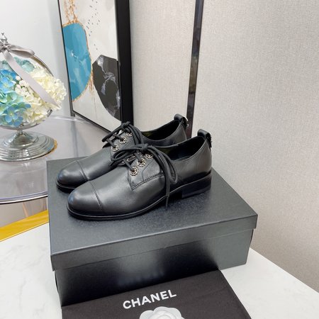 Chanel Lace-up diamond leather shoes with chain logo