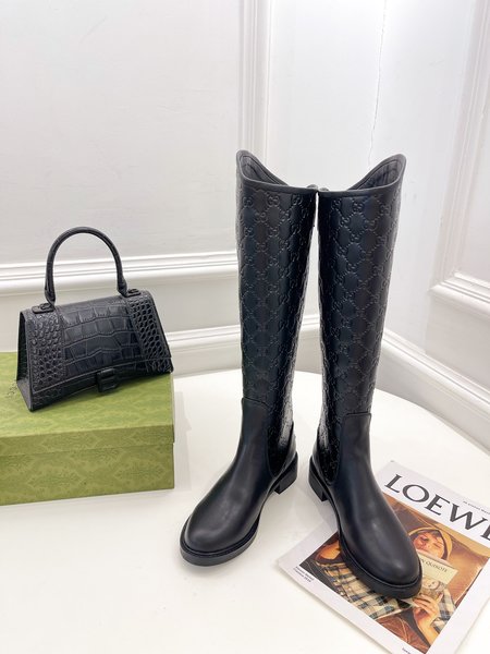 Gucci embossed boots