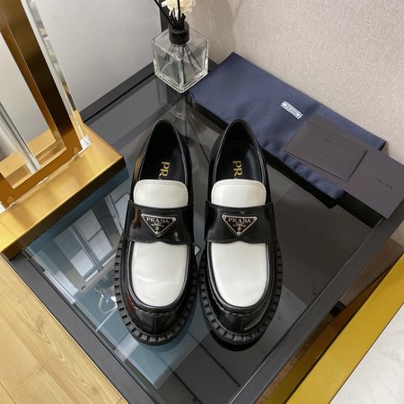 Prada triangle buckle platform loafers