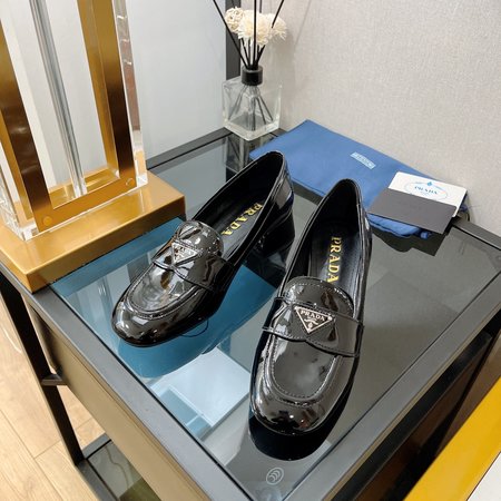 Prada Patent leather mid-heel loafers with triangle logo design