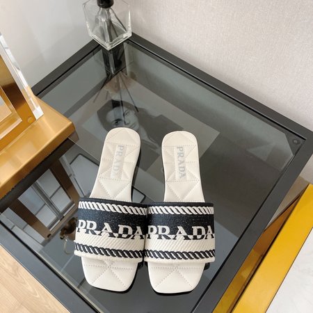 Prada embroidered slip-on sandals