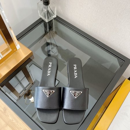 Prada triangle logo flat slippers