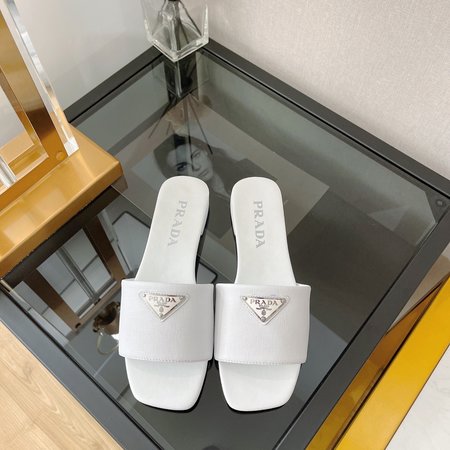 Prada triangle logo flat slippers