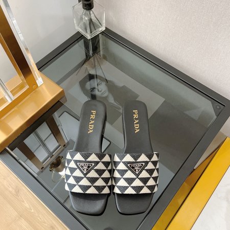 Prada triangle logo flat slippers