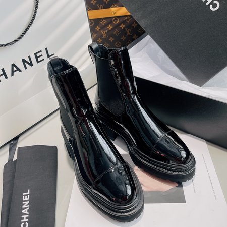 Chanel lace-up flat boots