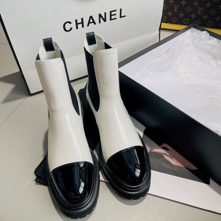 Chanel lace-up flat boots