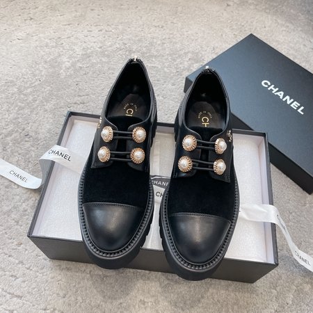 Chanel Stylish boots with classic pearl buckle design