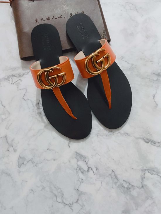 Gucci Cowhide Upper Flip Flops with Metal Decor