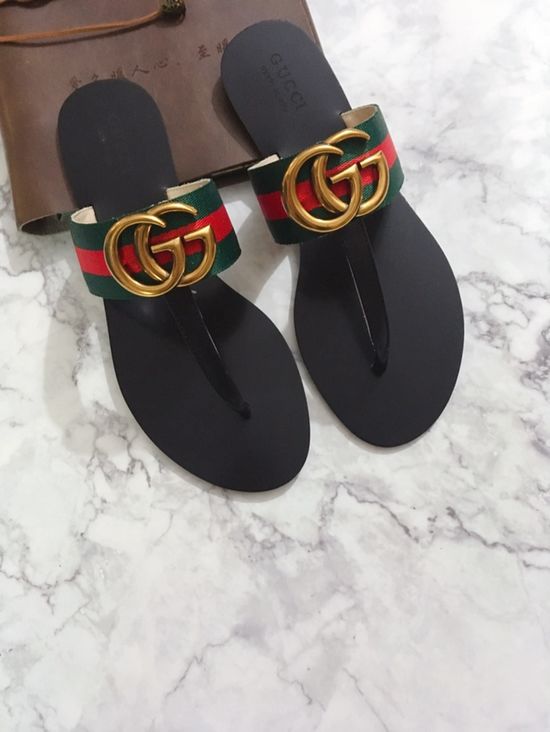 Gucci Cowhide Upper Flip Flops with Metal Decor