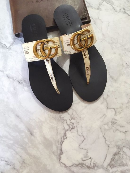 Gucci Cowhide Upper Flip Flops with Metal Decor