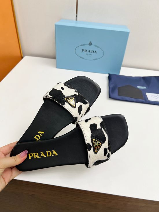 Prada Cow Print Leather Loafers with Signature Emblem