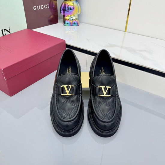 Valentino Elegant Metal Element Flats with Exquisite Rivet Accents
