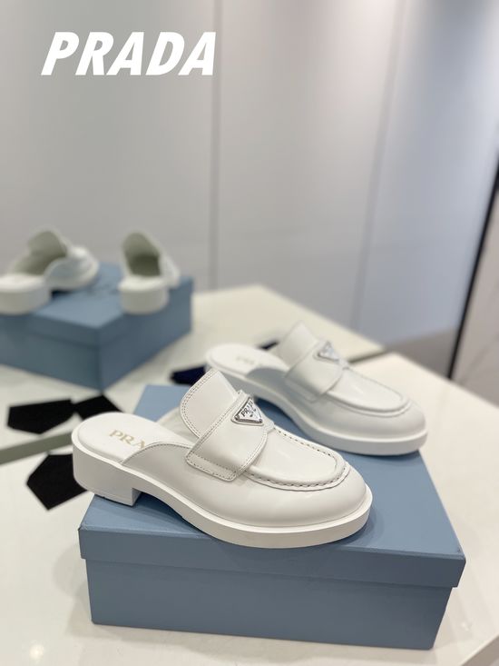 Prada Elegant Loafer Slippers with Trendy Triangular Logo