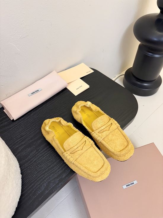 Miu Miu Classic Square Toe Leather Loafers with Decorative Emblem