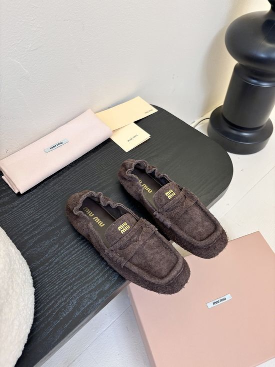 Miu Miu Classic Square Toe Leather Loafers with Decorative Emblem