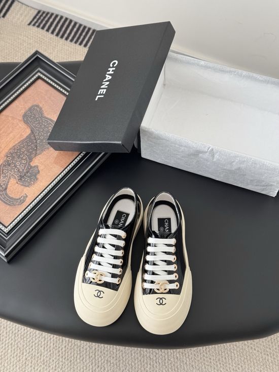 Chanel Stylish White Sneakers with Embossed Logo