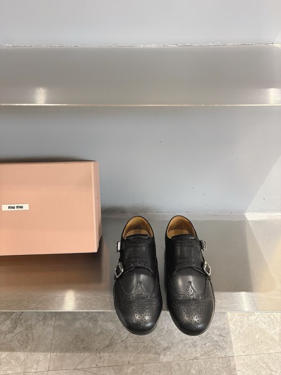 Miu Miu Engraved Brogue Loafers with Tassel Details