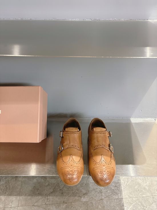 Miu Miu Engraved Brogue Loafers with Tassel Details