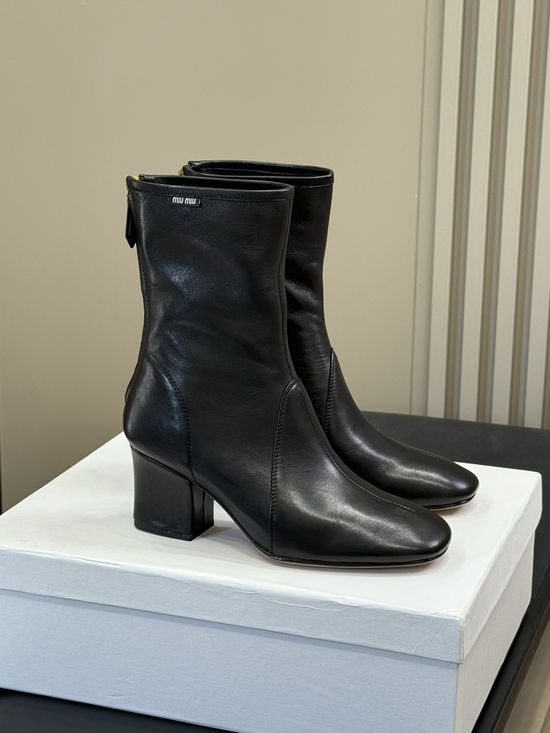 Miu Miu Knee High Stretch Boots With Decorative Metal Buckle